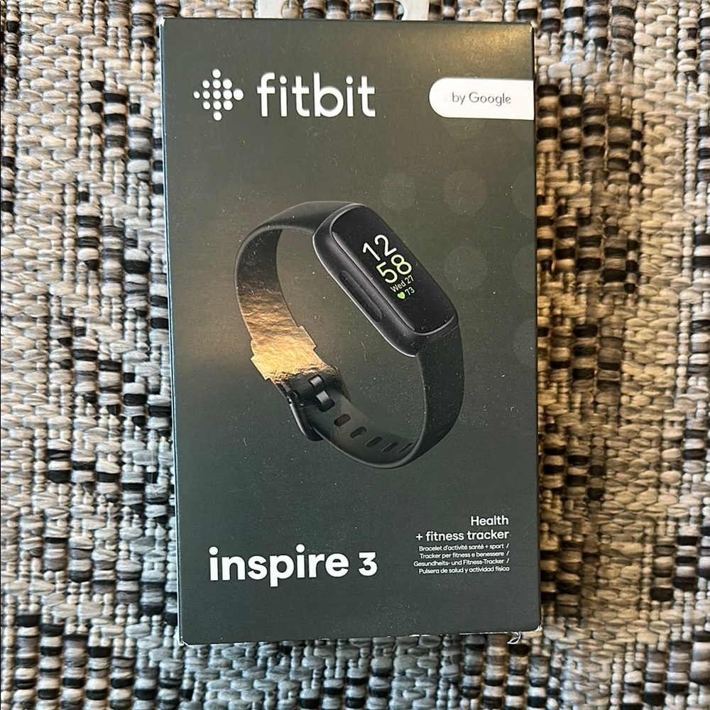 Fitbit Black Smartwatch with Sleek Design and Curved Display